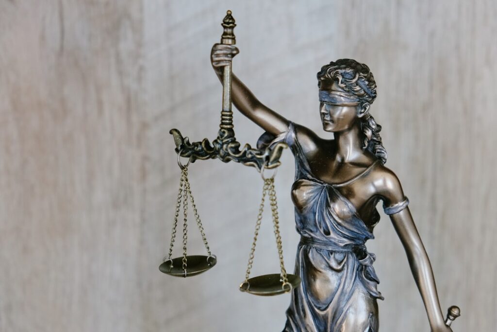 Lady Justice statue — NJ vs NY personal injury claim comparison