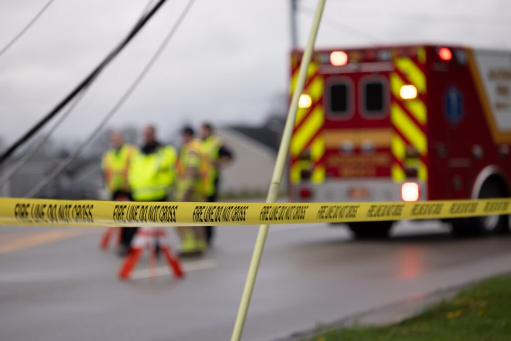 Emergency responders and fire truck at car accident scene — Personal Injury legal column