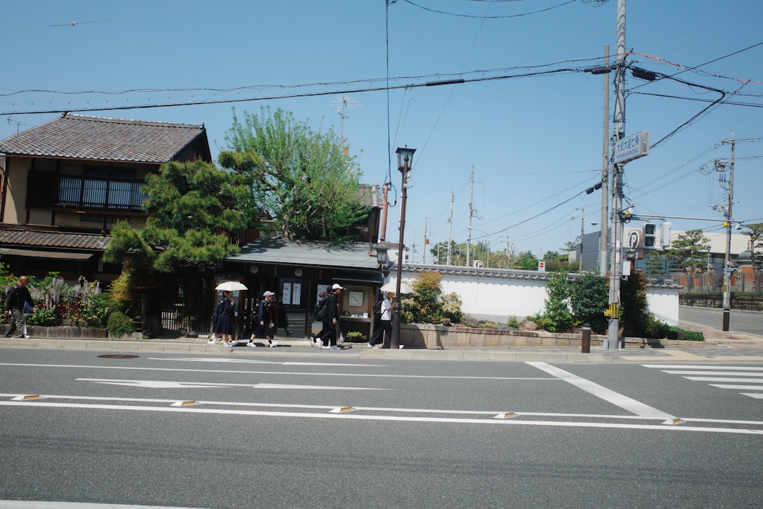 Students in uniform wait at a crosswalk — child pedestrian school crosswalk claims