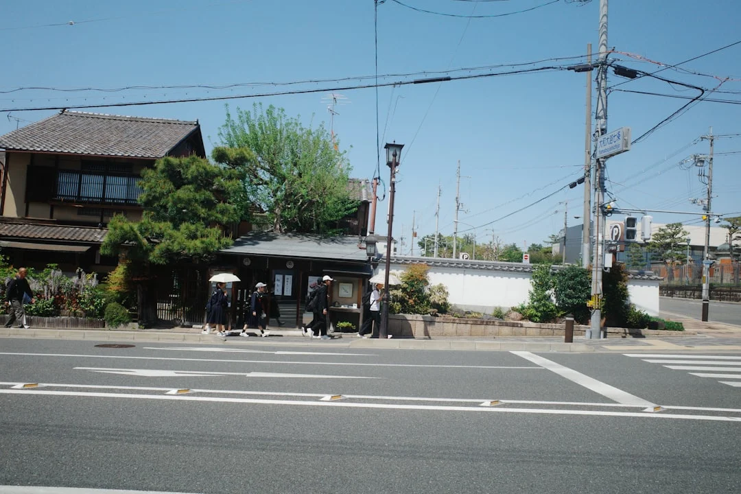 Students in uniform wait at a crosswalk — child pedestrian school crosswalk claims