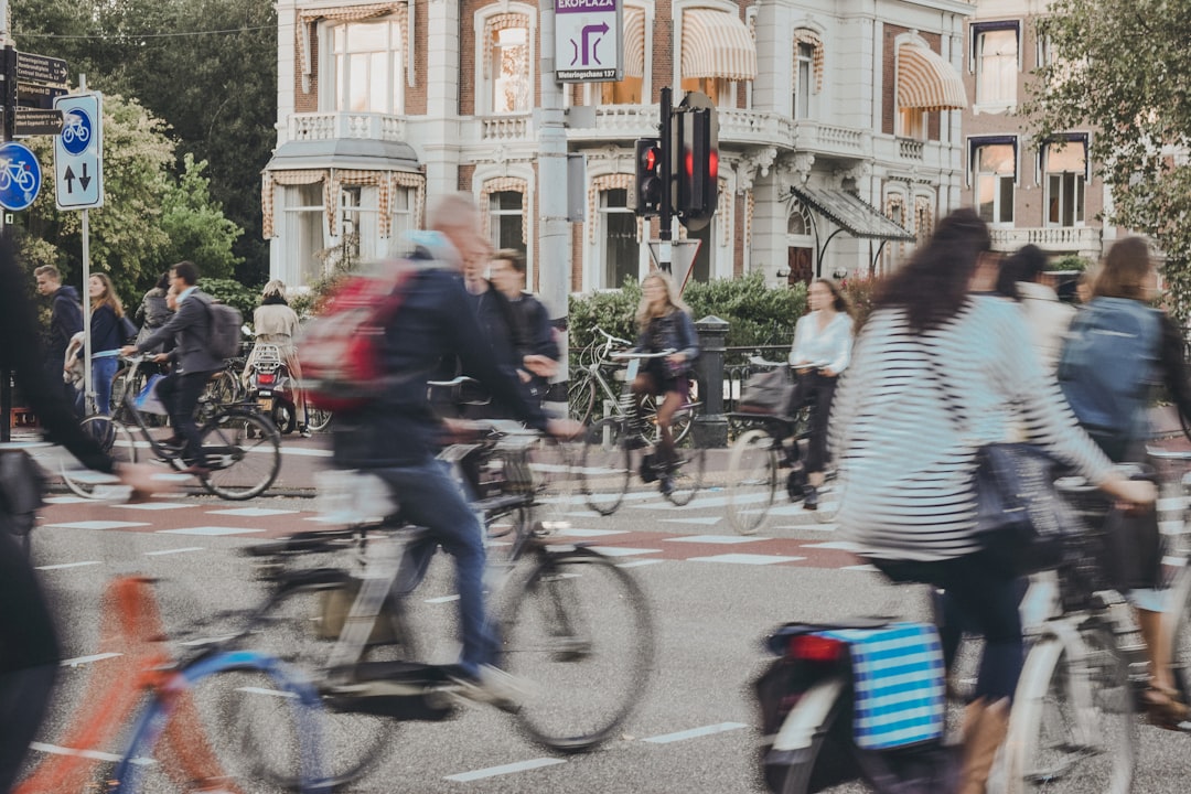 People riding bicycles on road — bicycle, e-scooter, delivery rider accidents