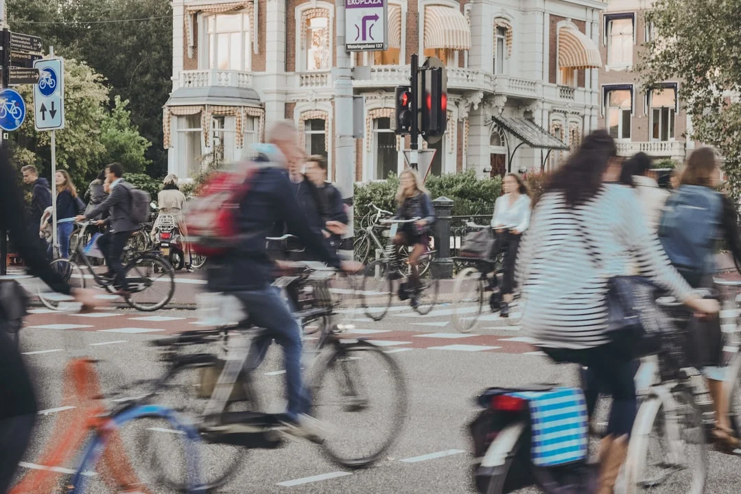 People riding bicycles on road — bicycle, e-scooter, delivery rider accidents
