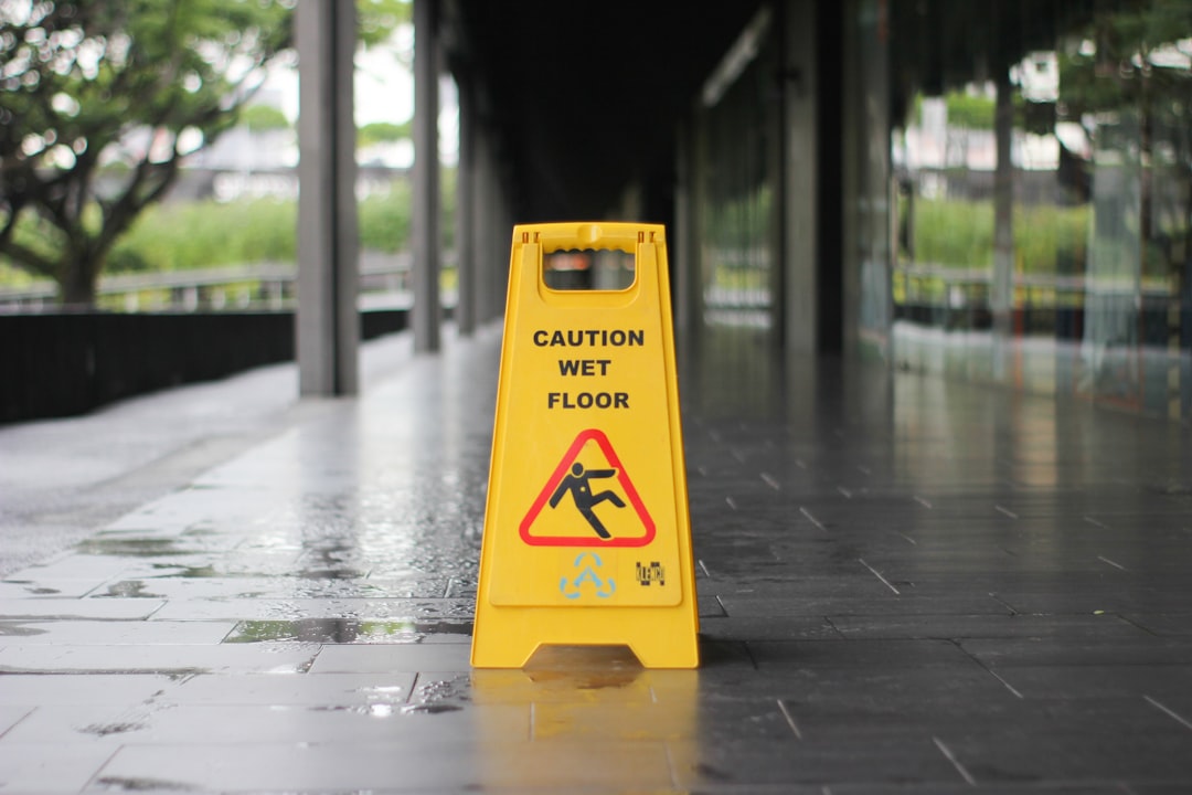 Yellow caution wet floor signage — slip and fall liability