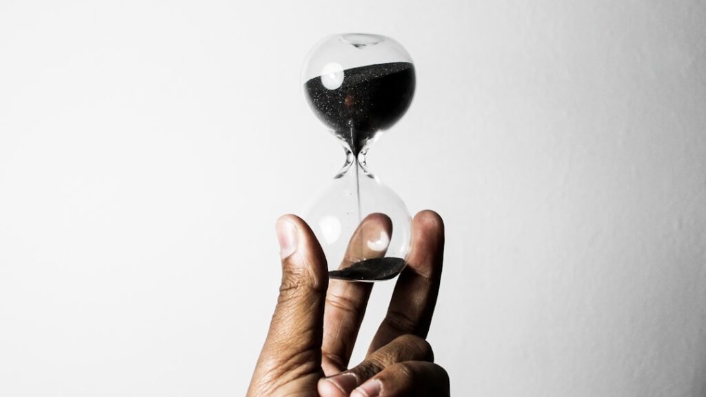 Hourglass in hands representing the two-year statute of limitations for NJ personal injury lawsuits