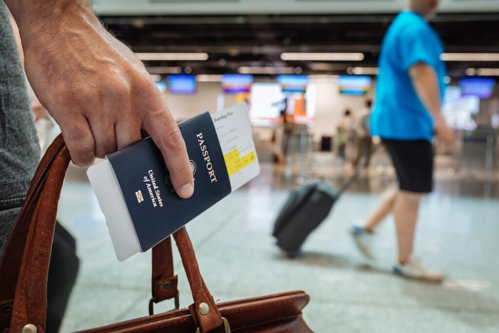 Hand holding a passport representing international child custody and Hague Convention cases
