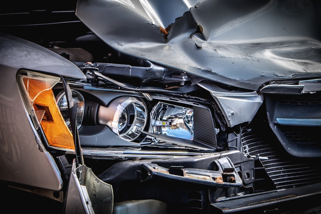 Damaged car engine representing NJ head-on collision cases and centerline crossover fault