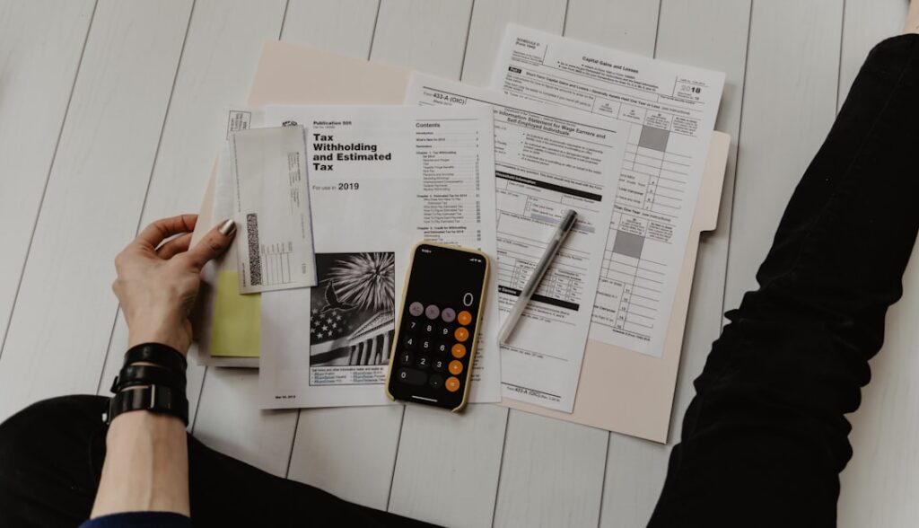 Person with calculator and paper representing alimony modification calculations after change of circumstances NJ