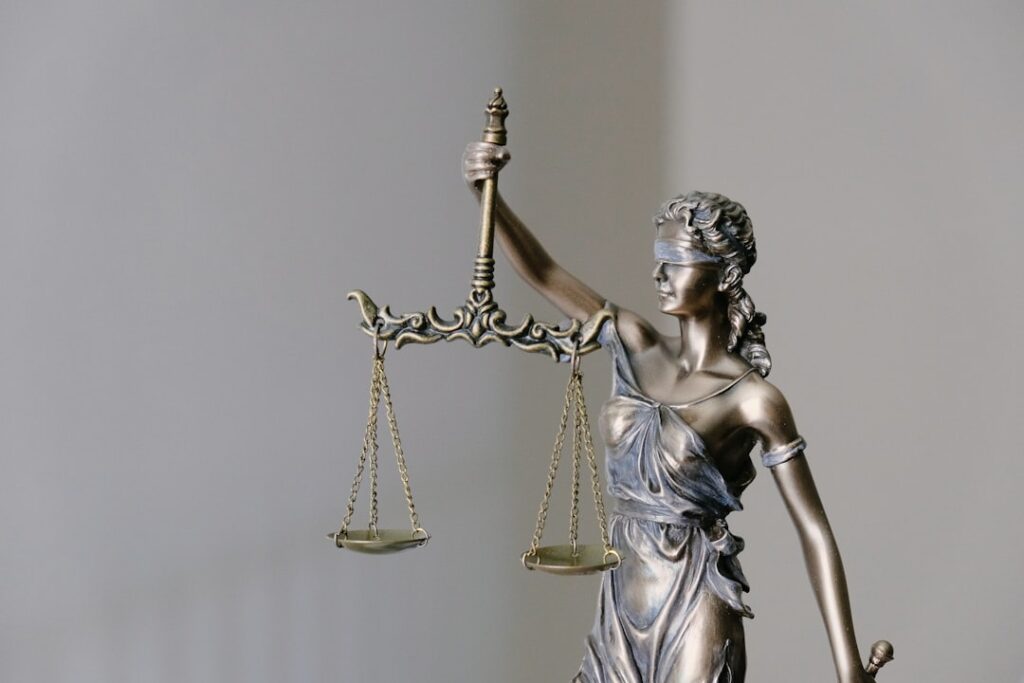 Lady Justice balance scale representing NJ 51 percent modified comparative negligence rule